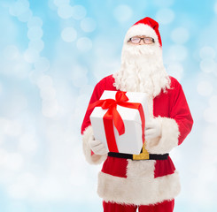 man in costume of santa claus with gift box