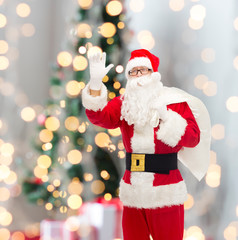 man in costume of santa claus with bag
