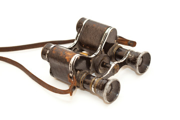 Old vintage binoculars isolated on white background