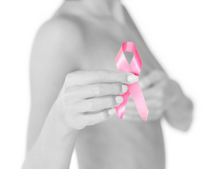 hand holding pink breast cancer awareness ribbon