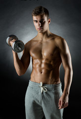 Fototapeta na wymiar young man with dumbbell