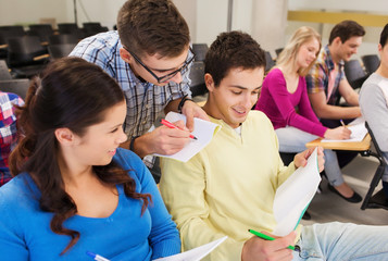 group of smiling students in lecture hall
