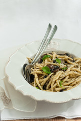 Freshly cooked pasta(trofie) with mushrooms, vegetable and parme