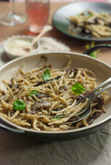 Freshly cooked pasta(trofie) with mushrooms, vegetable and parme