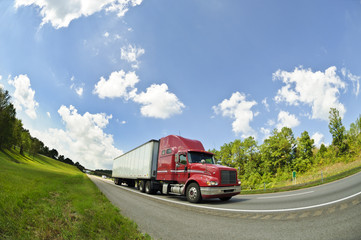 Red Semi Truck On Interstate Highway (1)