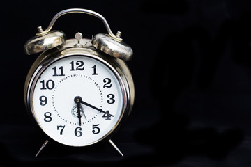 Retro clock on black background