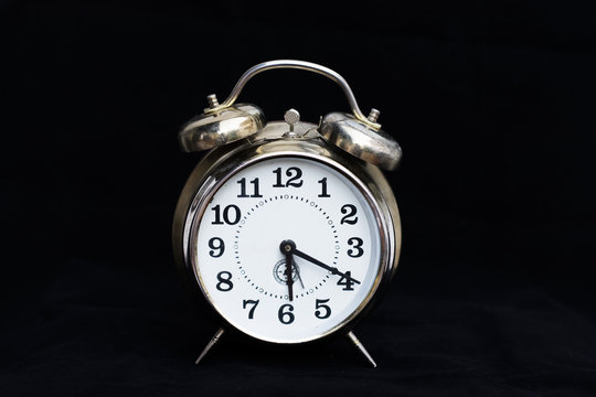 Retro clock on black background