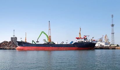 Loading of big Industrial cargo ship in Burgas port, Bulgaria