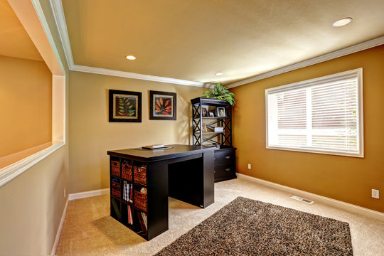 Office area with dark brown furniture
