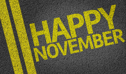 Happy November written on the road