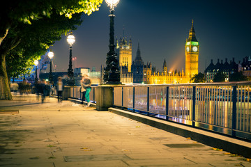 View of London England skyline and Big Ben seen at night.