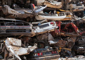 Abstract background, dump of stacked cars in junkyard