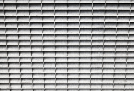 Gray industrial metal panel with lattice grid