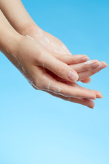 Woman's hands in moisturizer cream