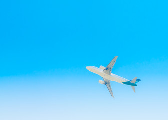 Fototapeta na wymiar Airplane in clouds background.