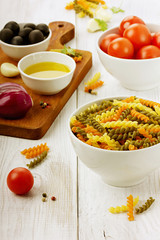 Pasta before preparation on a wooden background