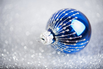 Christmas blue decor. Vintage Christmas decoration on silver glitter background