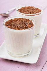 Milkshake for two with chocolate on a vintage surface
