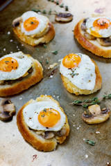 Breakfast with fried quail eggs, mushrooms and toast