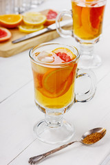 Ice tea with fruits on a light background