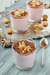 Milkshake with chocolate and cookies on a vintage wooden board