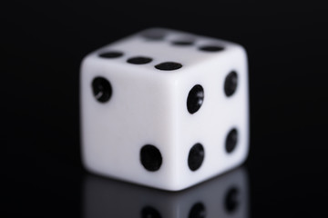 Game dice on black background