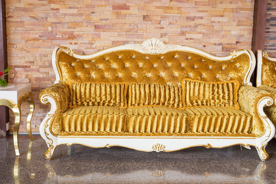 Beautiful vintage sofa next to wall