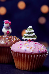 Cupcakes with christmas decorations, portrait view