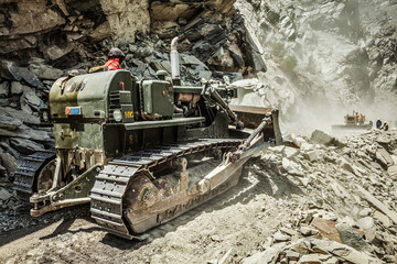 Bulldozer doing road construction in Himalayas