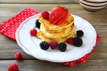 pancakes and berries on a plate