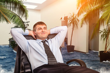 Businessman is dreaming about vacations