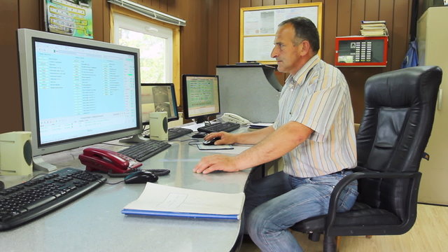 Adept Engineer Work On Computer With Three Monitors