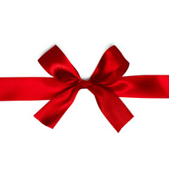 Shiny red satin ribbon on white background