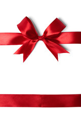 Shiny red satin ribbon on white background