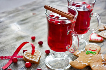 Mulled wine with cranberry and gingerbread cookies copy space