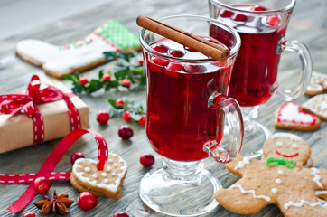 Mulled wine with cranberry and gingerbread cookies and gift box