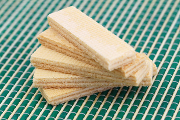 Vanilla wafers on green bamboo mat