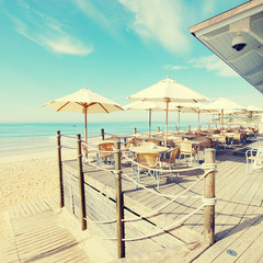 outdoor terrace cafe on sand beach