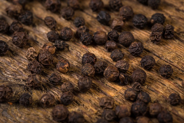 black pepper on wooden table
