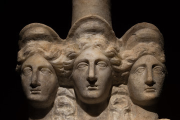 Three headed roman-asian ancient statue of beautiful women