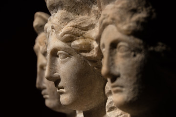 Three headed roman-asian ancient statue of beautiful women