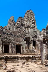 Fototapeta premium The ancient ruins of a historic Khmer temple in the temple compl