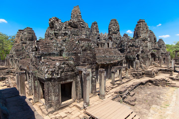 Fototapeta na wymiar The ancient ruins of a historic Khmer temple in the temple compl