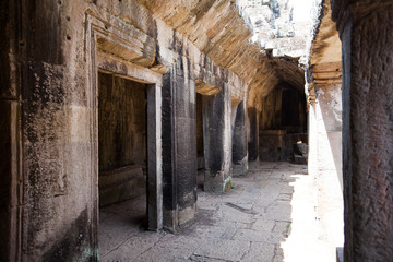 The ancient ruins of a historic Khmer temple in the temple compl