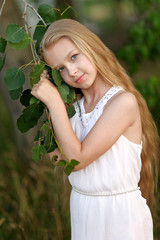 portrait of little girl outdoors in summer