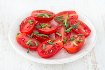 salad tomato with green onion in plate