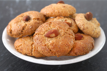 almonds cookies on white plate