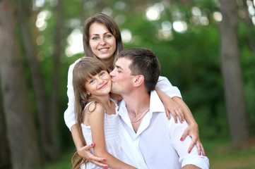 Fototapeta premium portrait of a happy family in summer nature