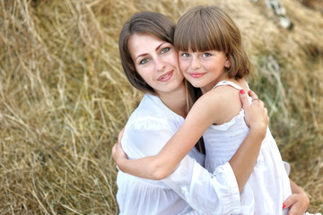 portrait of mother and daughter in nature