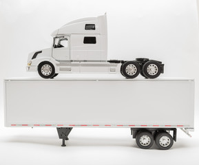 View of transport truck and trailer model on grey background © Vit